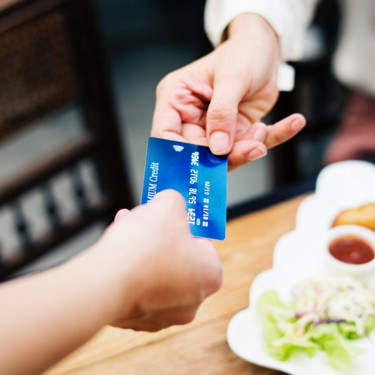 banking-card-credit-card-1332191 person ordering food and paying server with credit card