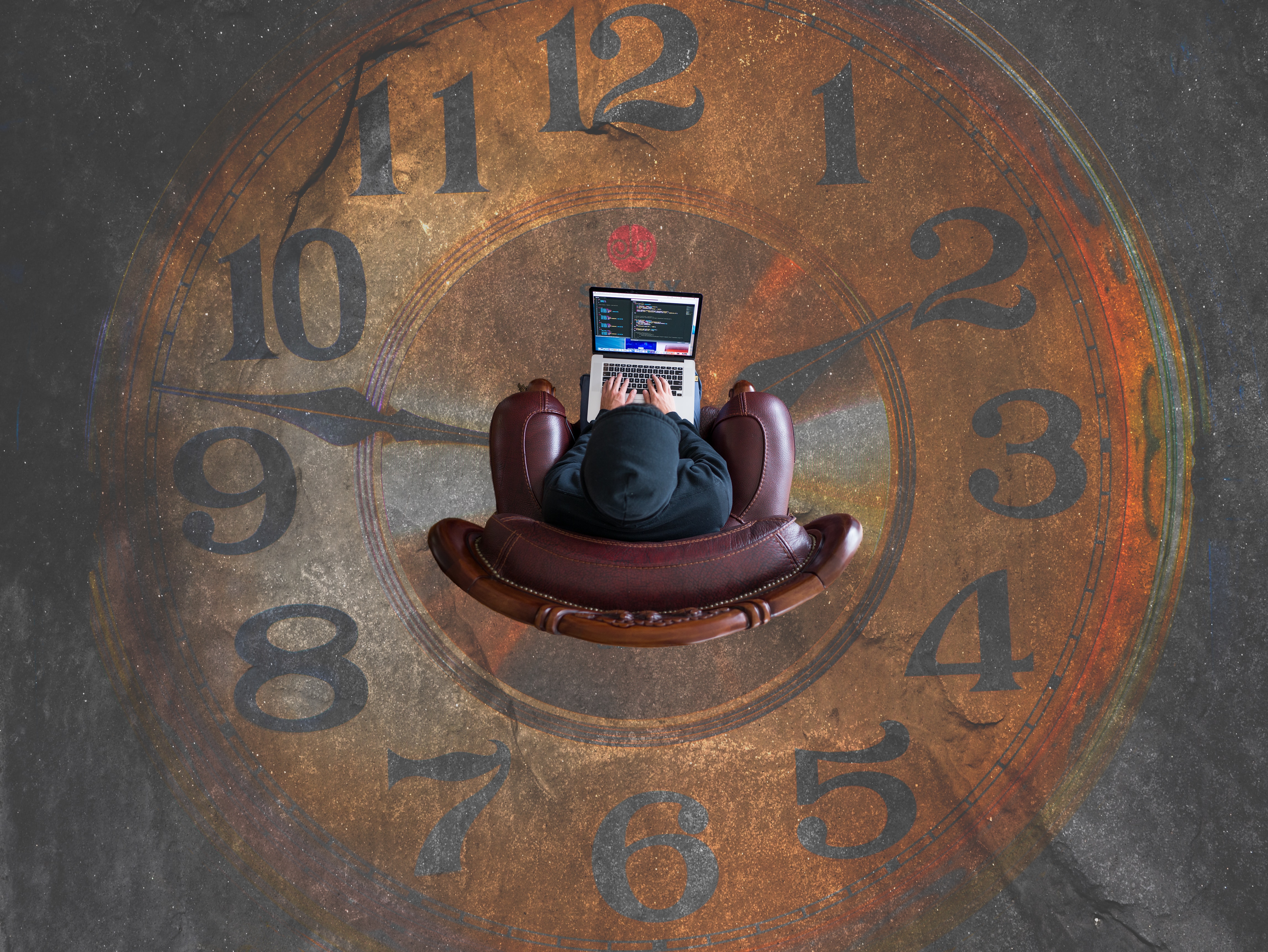 person sitting in chair on clock shaped rug