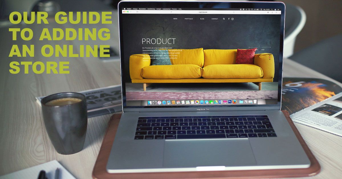 macbook with furniture website on screen