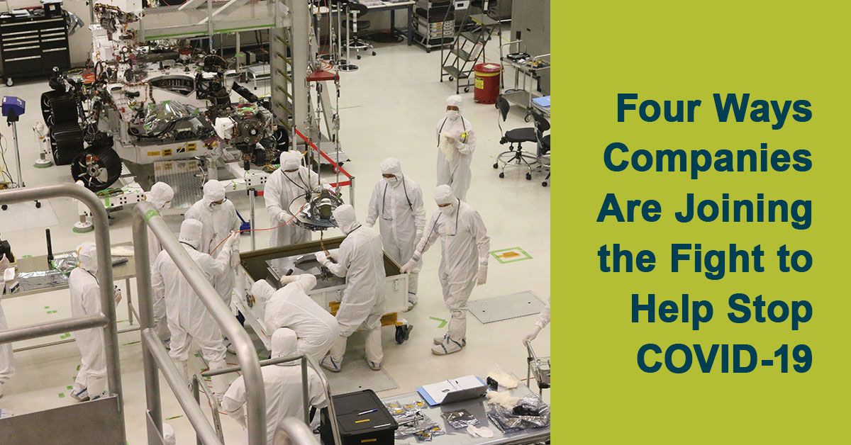 People in protective suits working in a facility