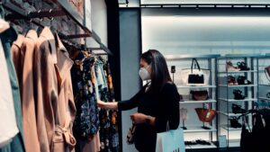 Woman shopping with face mask on during COVID-19