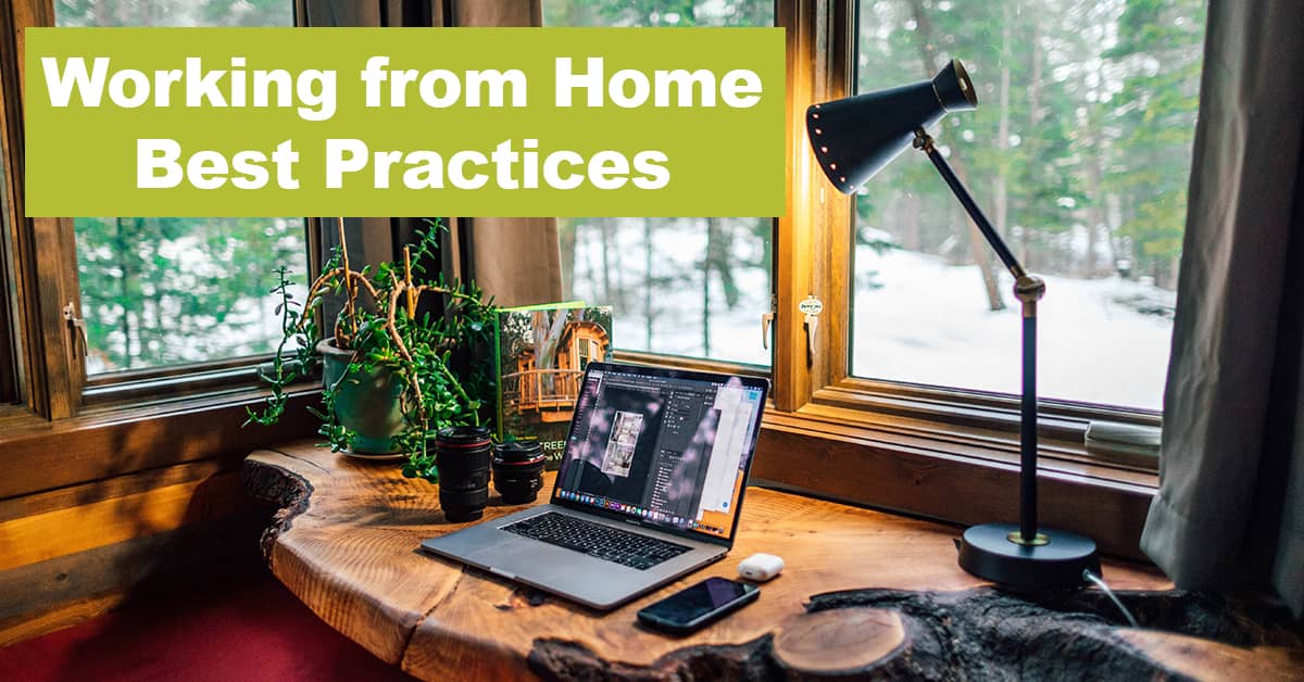 Work from home setup with lamp shining over laptop