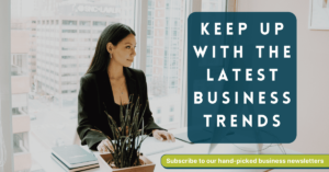 White text "Keep up with the latest business trends" on blue background. Image of woman sitting at desk in a bright white office.